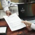 high angle hands holding document