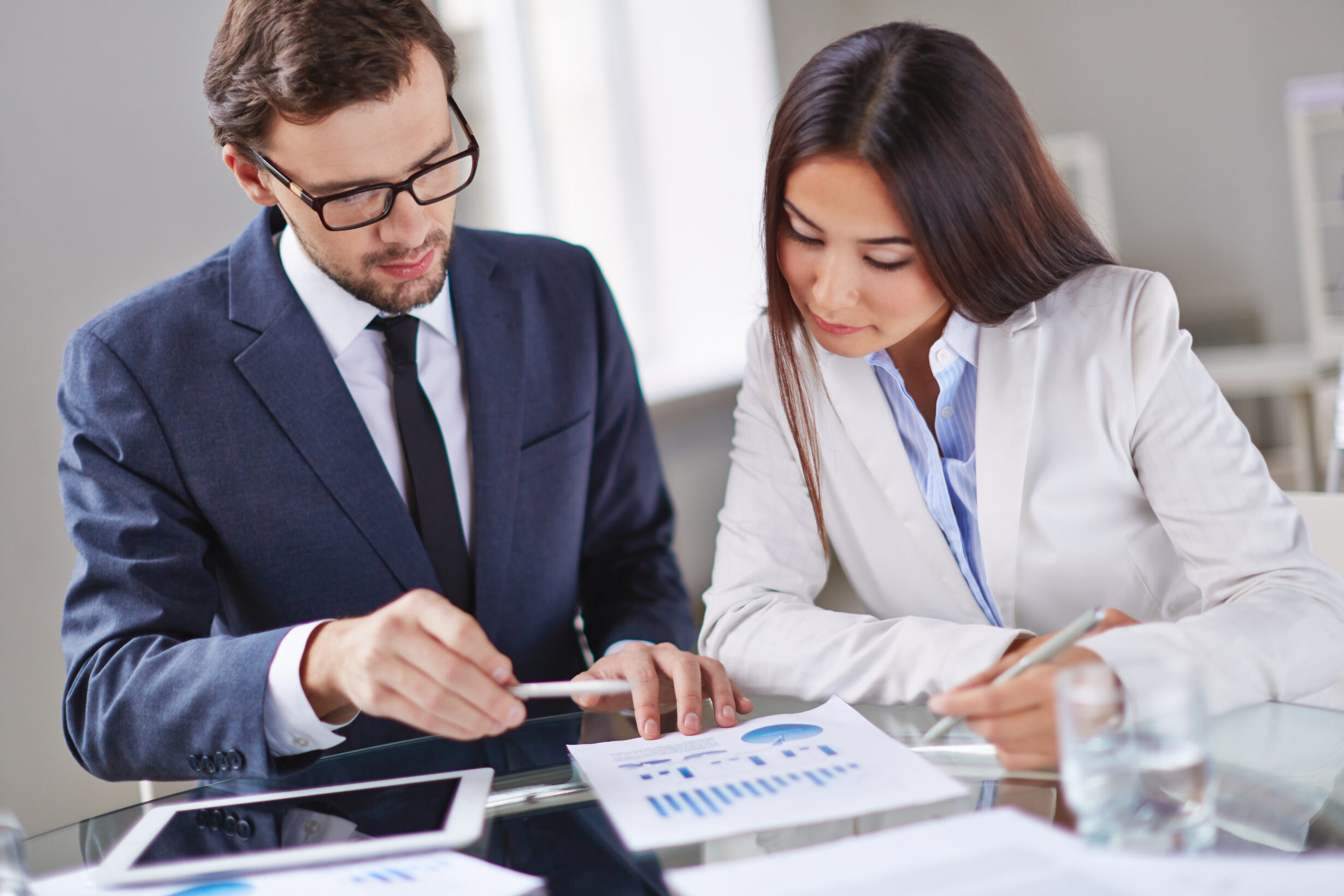 elegant executives reviewing report scaled